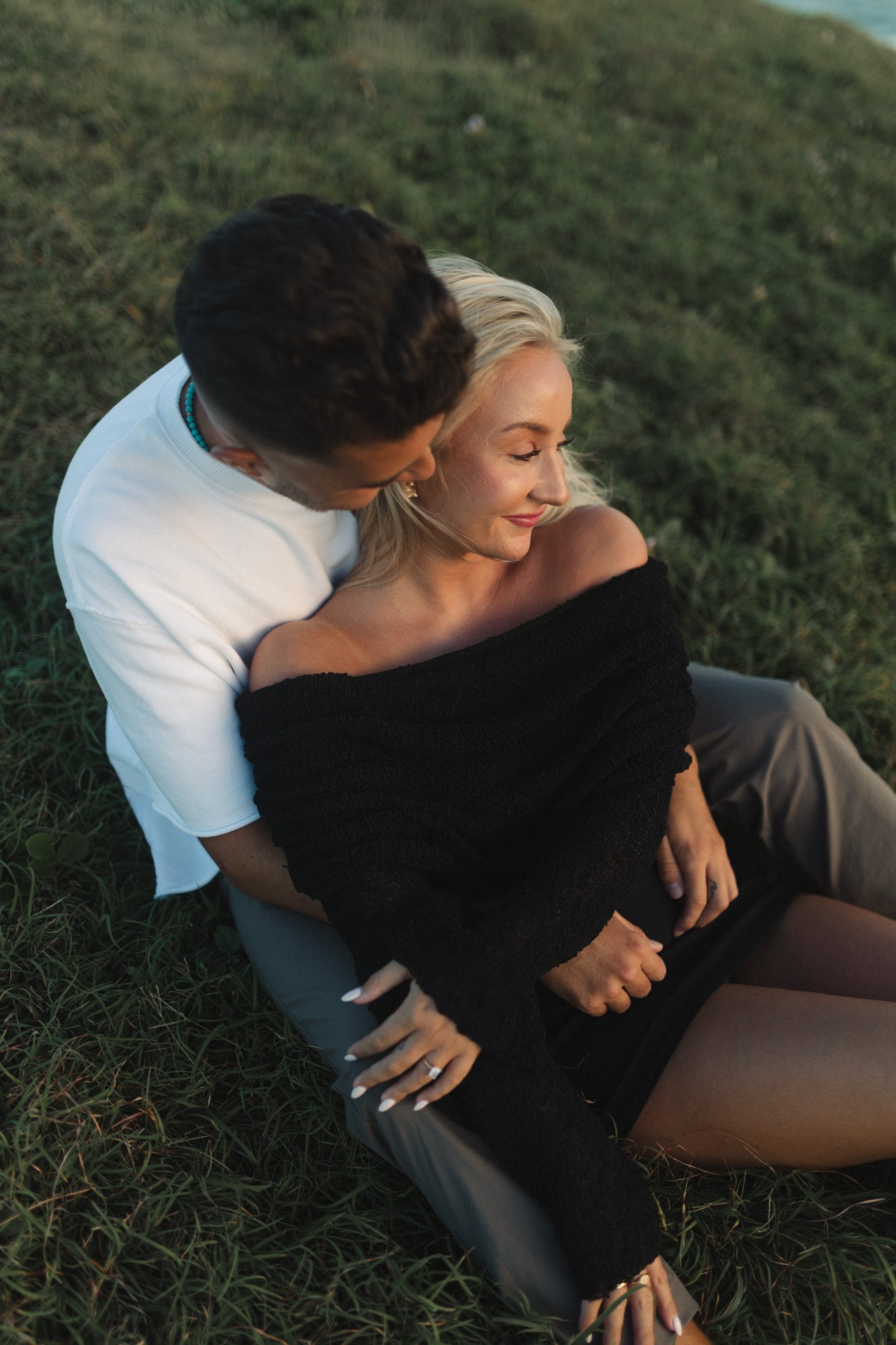 Sarah and Alex sitting in the grass